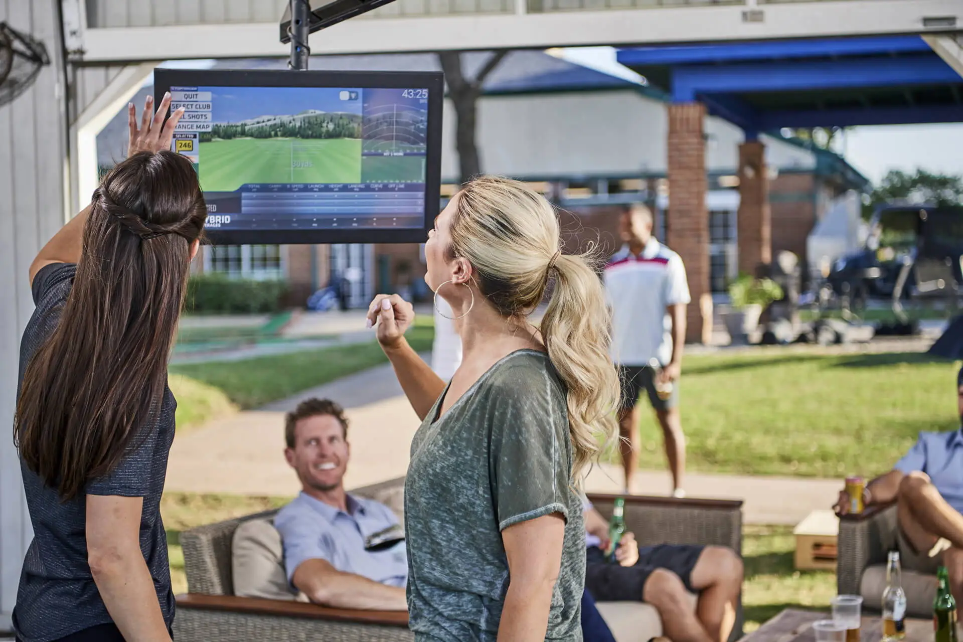 Friends playing on a Toptracer bay